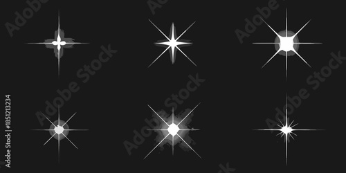 Collection of sparkling starbursts and light flares on a black background