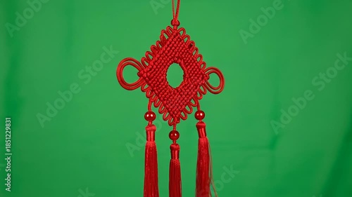 Traditional Chinese Knotting Decoration with Tassels on Green Screen Background.