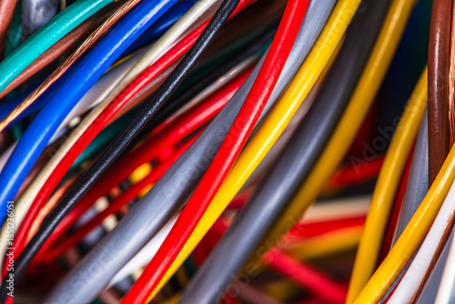 Bundles of multicolored cable wires in electrical installations, close-up view