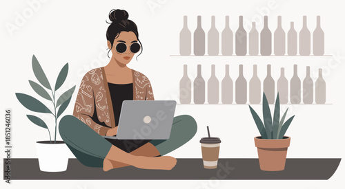 A focused woman works on her laptop in a modern cafe or bar, illustrating remote work, digital nomad lifestyle, productivity, business environment, technology usage, social media activity, and profess