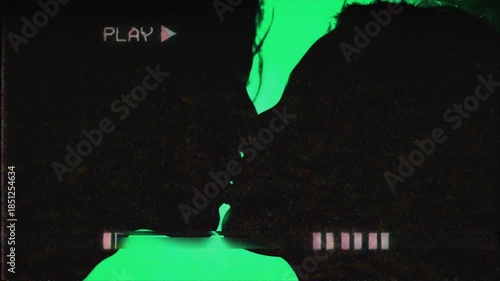 Silhouettes of heterosexual couple express their love for each other with a gentle kiss on the lips on the stage. Retro VHS effect. 