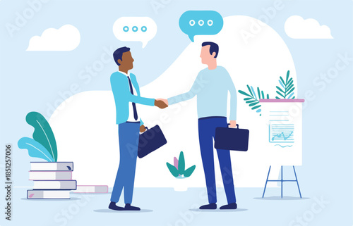 Casual business people shaking hands over deal - Two men in office doing handshake while talking. Agreement and cooperation concept.