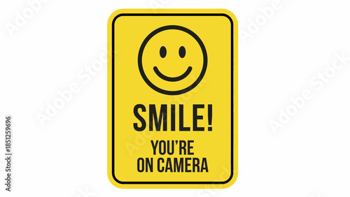 Bright yellow sign with a happy smiley face and text that reads 'SMILE! YOU'RE ON CAMERA' in bold black letters