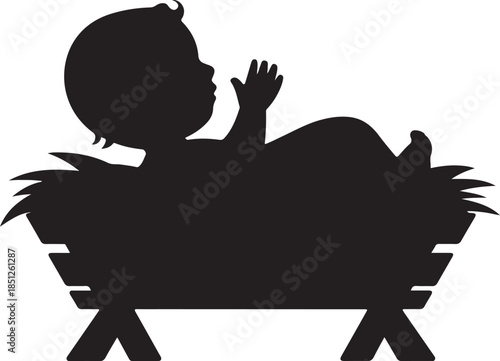 Silhouette of a newborn baby resting peacefully in a simple manger