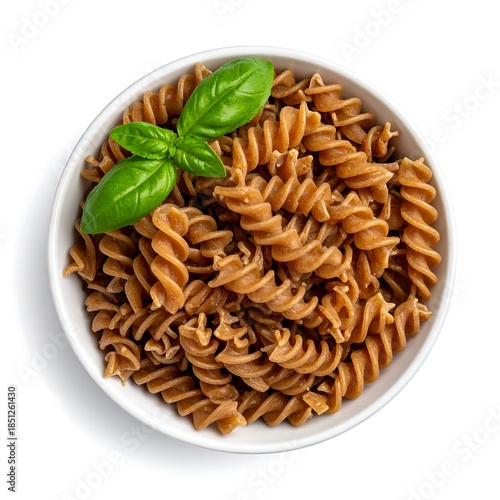 Spiral whole wheat pasta in a white bowl