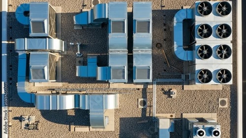 Industrial HVAC units spinning on clean commercial building rooftop