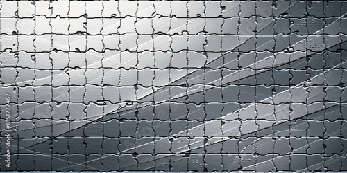 Rough tire tracks cut through a dusting of snow over a grey cobblestone street with a textured granite pattern on the urban pavement surface