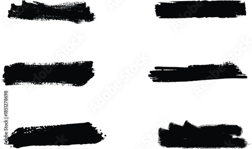 Set of four black grunge ink brush strokes and paint smears