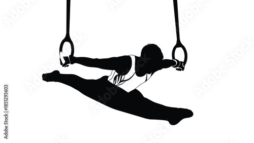 Silhouette of person performing aerial yoga on hanging rings