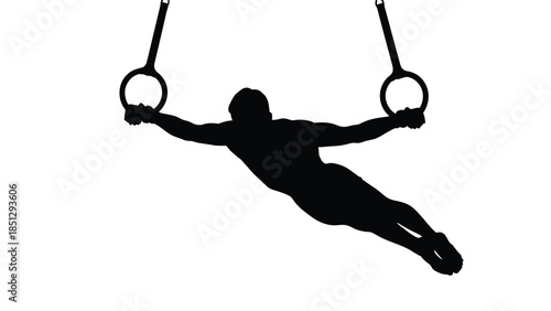 Silhouette of person hanging from gymnastic rings