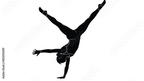 Silhouette of a person doing a handstand with legs split