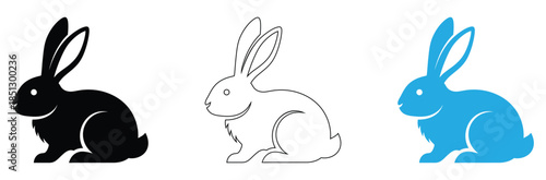 Three rabbits in different colors sitting peacefully