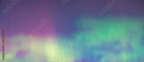 Pastel curtain of mint-green and violet aurora drifting across a hazy night sky, softly blurred colors blending together like a watercolor wash above the quiet polar horizon

