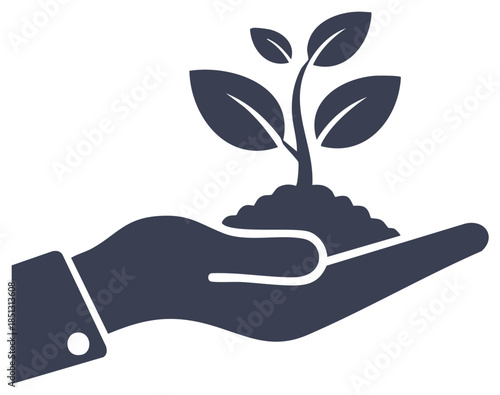 Silhouette of a hand holding a small plant growing out of soil
