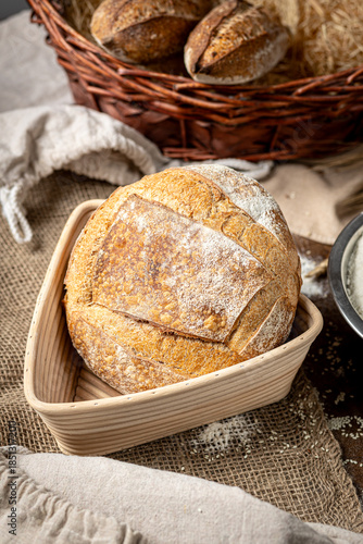 Freshly baked artisan bread in basket, perfect for breakfast or lunch, rustic and inviting