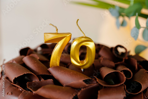 Golden 70th Birthday Candle on Sophisticated Cake with Chocolate Shavings