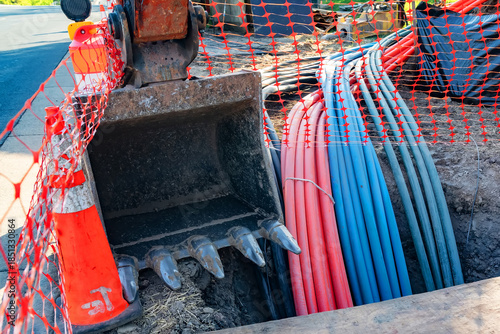 Φωτογραφία excavator and equipment for laying broadband internet cables underground