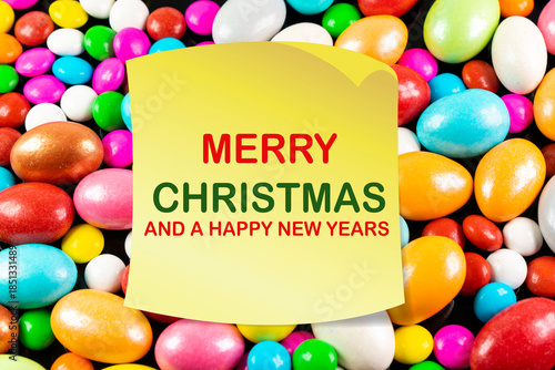 Sticky note with Merry Christmas And a Happy New Years