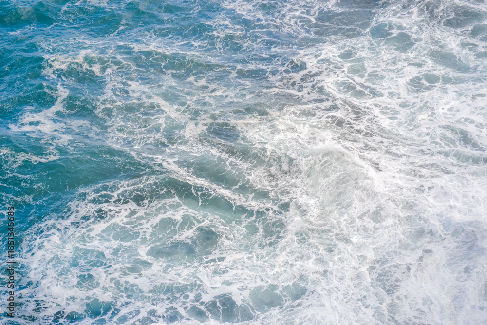 Fototapeta premium Abstract ocean water texture with waves and sea foam