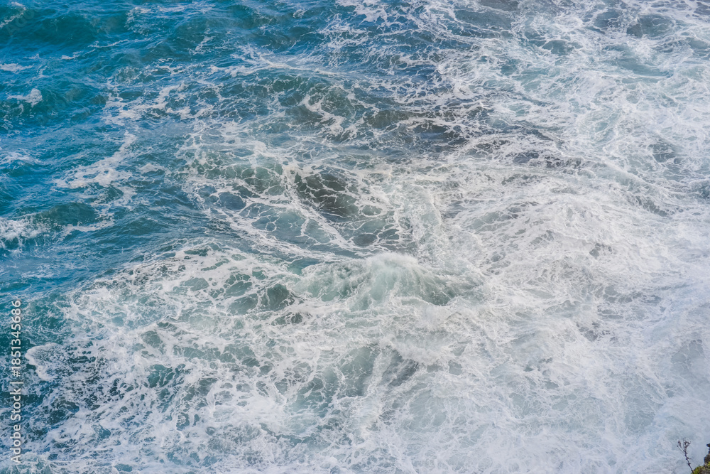 Fototapeta premium Abstract ocean water texture with waves and sea foam