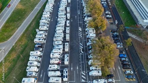 Camper parking lot in Piazzale Azzuri d'Italia, Cremona, Italy, full of recreational vehicles