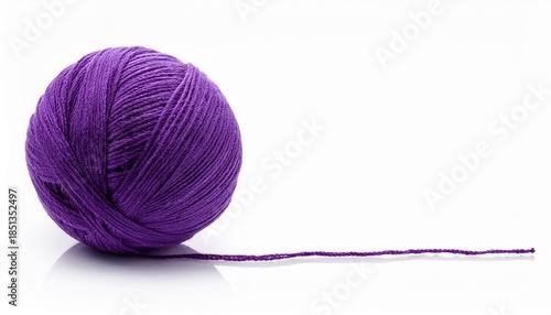 a ball of purple yarn with a long thread isolated on white background