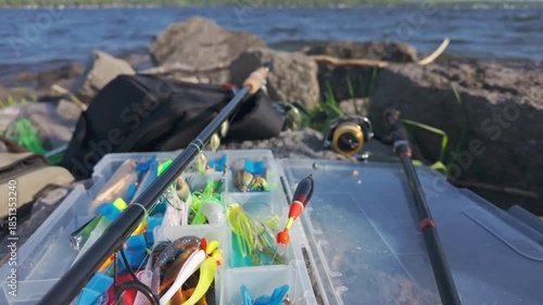 Wallpaper Mural Family leisure water sports fishing. Fishing spinning and casting rods with fishing tackles on rocks near lake shore background, close up. Fishing rods lines, bobber and plastic jigs with worm lures. Torontodigital.ca