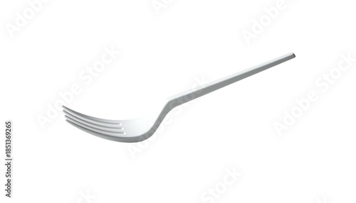 A white plastic utensil with tines, angled against a black background