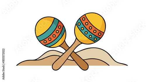 Colorful maracas crossed on sandy background  