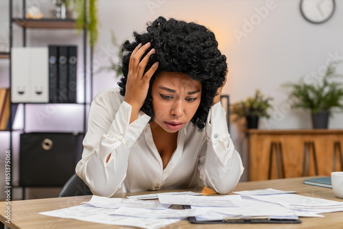 Cuadro en lienzo African American businesswoman at home office views bills on invoices feeling stressed about debt and taxes