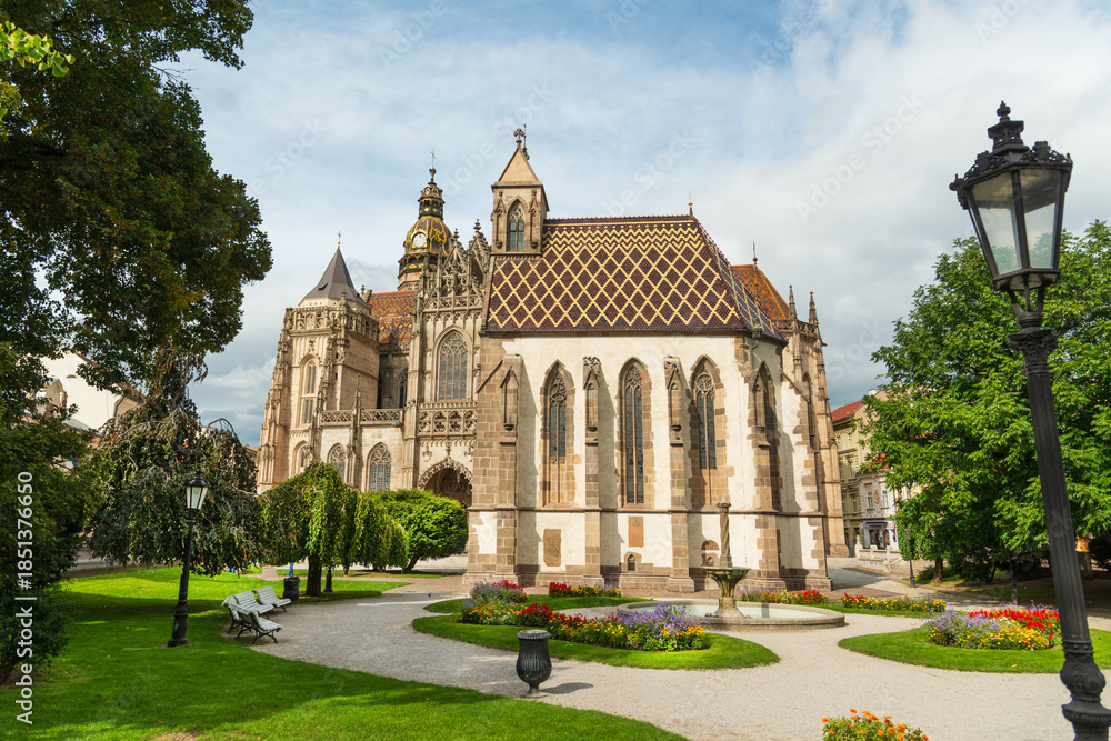 Fototapeta premium Beautiful city park in front of medieval Saint Michael chapel and Saint Elizabeth cathedral on Hlavna (Main) pedestrian street in downtown Kosice, Slovakia