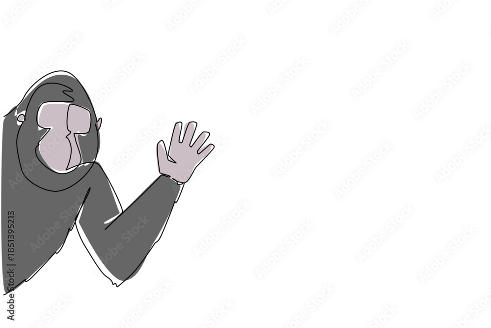 Obraz premium Continuous line drawing of a gorilla waving hand behind the wall, built with a nature concept and the theme animal waving hand, ideal for International Primate Day artistic celebration design.