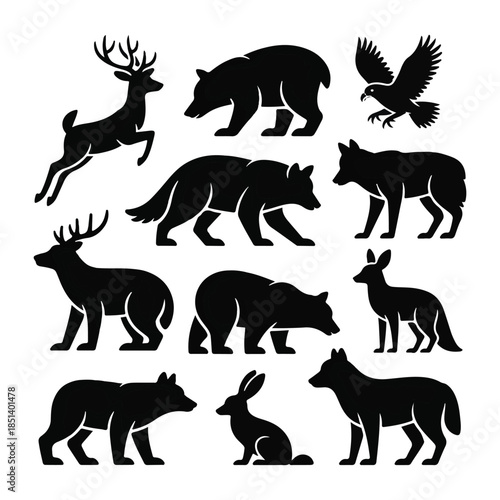 Collection of black animal silhouettes including deer bear fox rabbit and eagle white background.