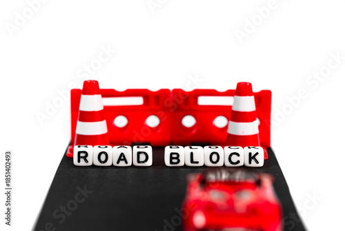 Concept of Road block , figuratively any obstacle, problem, or hindrance that stops progress towards a goal, created with toys.