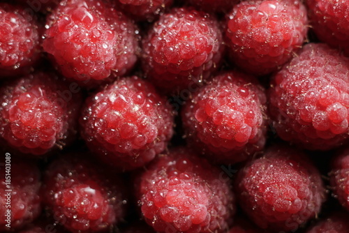 Raspberry close up studio shot over