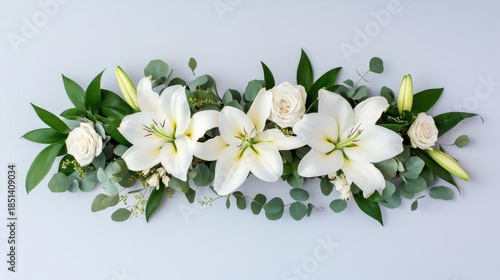 Elegant arrangement of white lilies and eucalyptus, isolated for a sophisticated and timeless wedding look