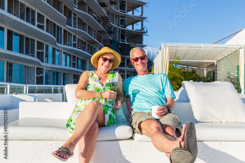 North America, Mexico, Nayarit, Bahia de Banderas, Nuevo Vallarta. Mature couple relaxing. MR