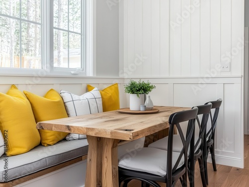 Modern farmhouse dining nook with cushioned seating and rustic table