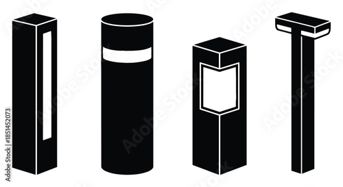 Four bollard lights, modern wayfinding outdoor lamps. Landscape lighting and pathway markers.