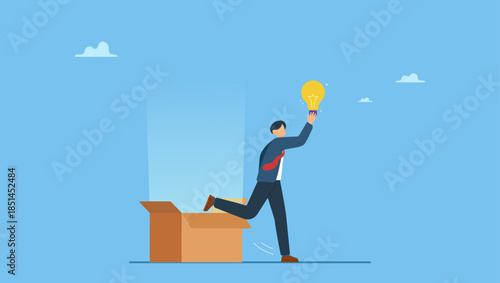 Smart businessman get out of paper box with new lightbulb idea. Think outside the box, creativity to create different business idea or motivation and innovation.