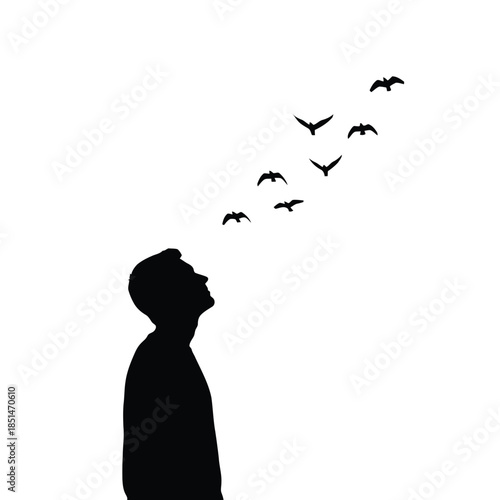 Silhouette of man with birds flying out of his head