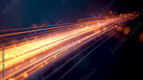 Orange light trails streaming diagonally across dark background with motion blur