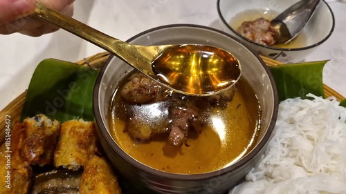 Bun Cha Vietnamese noodle soup with caramalized grilled pork slow