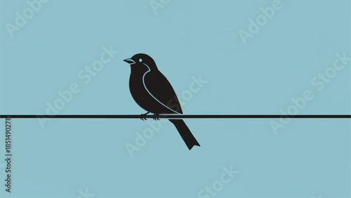 A solitary black bird perched on a wire against a clear sky.