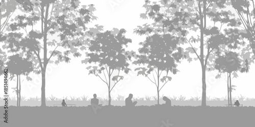 Silhouette of trees and people sitting in a field at dusk