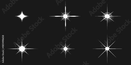 A collection of bright white starbursts and sparkles on a black background