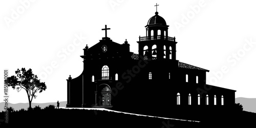 Silhouette of a historic church with bell tower at sunset
