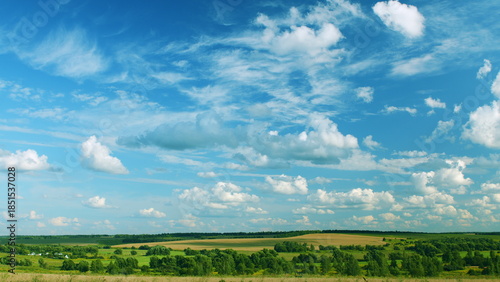 A Serene and Picturesque Landscape Featuring Fluffy Clouds and Lush Green Fields
