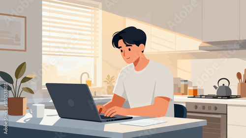 A man is sitting at a kitchen table with a laptop open in front of him. He is typing on the keyboard and he is focused on his work. The kitchen is well-lit, with a window providing natural light