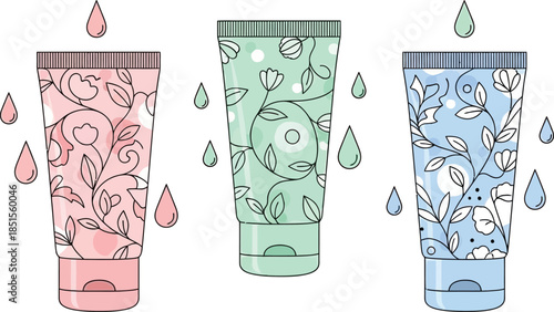 Three floral patterned cosmetic tubes with dripping liquid on transparent background